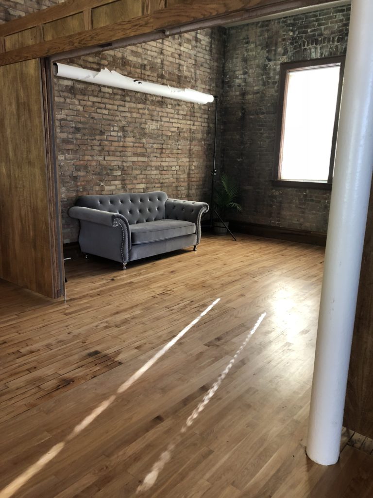 Room with couch and window at Cornerstone Studios