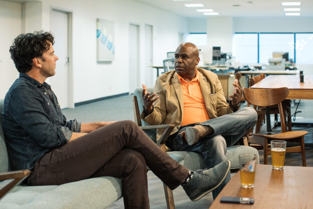 Photo of coworkers sitting at Launchpad